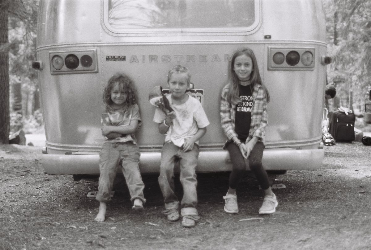 christen kids sitting on ramona the airstream