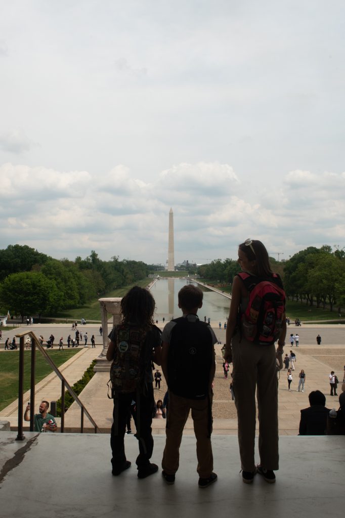 Children on the steps of Lincoln Memorial overlooking the National Mall