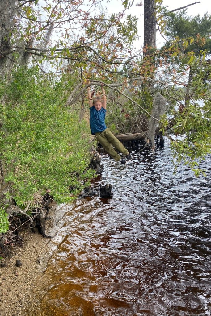 Boy fishing at free campsite in New Bern